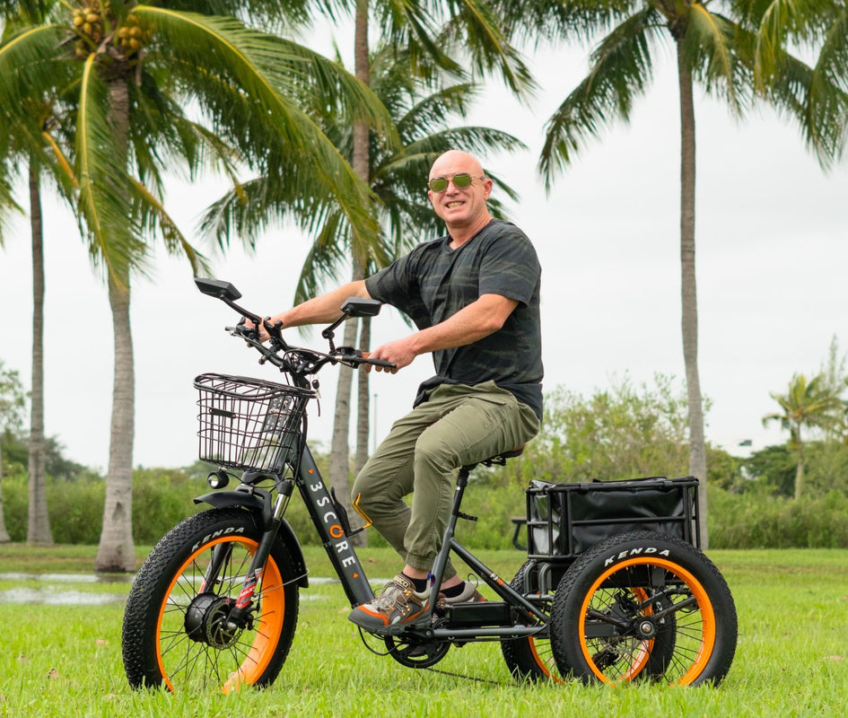 3SCORE Gray motorized trike with man enjoying outdoor 750W Motor with 48V Battery: Gives you power to ride in 3 wheels electric bike for 40+ Miles and 30+MPH. With 24 inches fat tires and the extra cushioned seat.